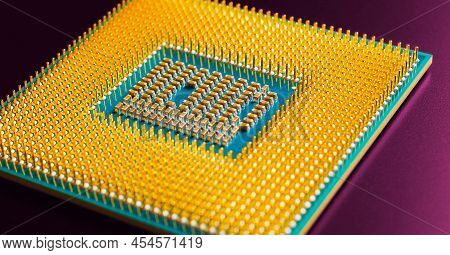 Computer Hardware. Processor Lies On Dark Magenta Matte Surface. Cpu And Semiconductors. Horizontal 