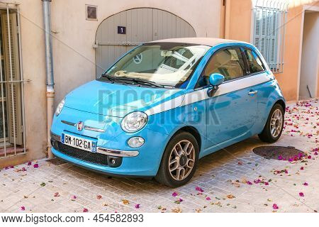 Saint Tropez, France - September 11, 2019: Cyan Minicar Fiat 500 In A City Street.