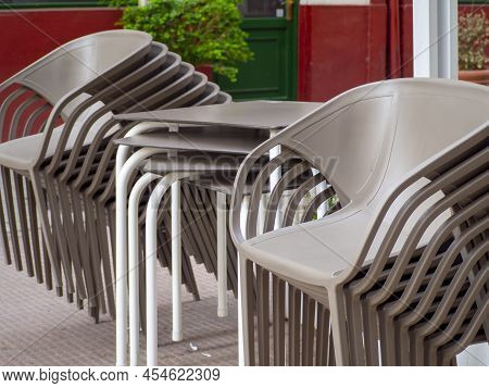 Empty Chairs And Tables At Closed Outdoor Restaurant For The Inflation Crisis.