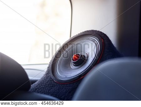 Car Speaker. Modern Car Sound Speaker With Red Details. Sunlight