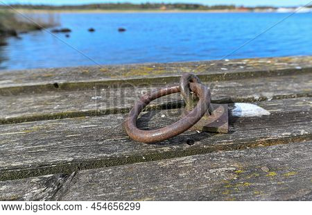 Old Jetty With Round Rusty Mooring Ring