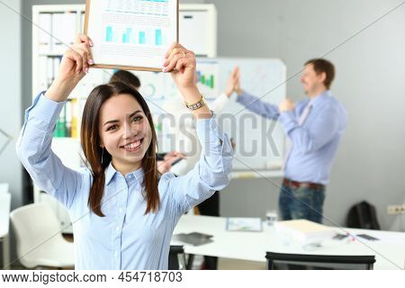 Portrait Of Woman Lift Document Over Head, Celebrate Good Deal, Beneficial Agreement. Well Done, Goo