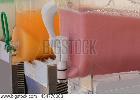 Dispenser Of Orange Flavored Grenadine Or Black Cherry Very Refreshing And Fresh Dessert For The Sum