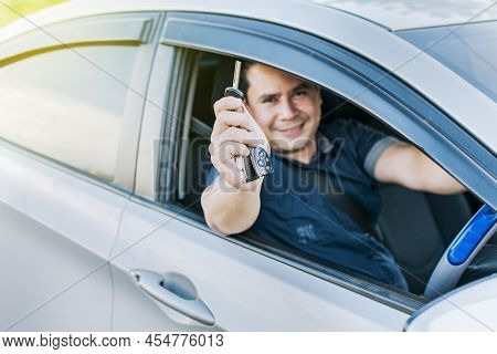 Person In His Vehicle Showing His Car Keys, A Man In His Vehicle Showing His New Car Keys, A Happy G