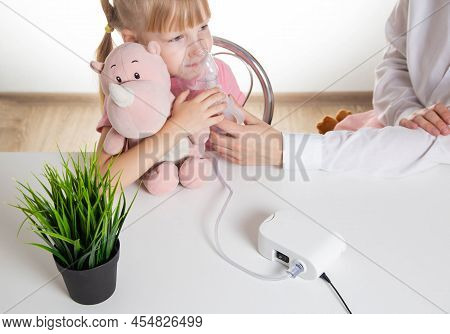 A 5-year-old Girl Breathes Into An Inhaler To Dilute Sputum In Case Of Lung Diseases. Treatment Of C