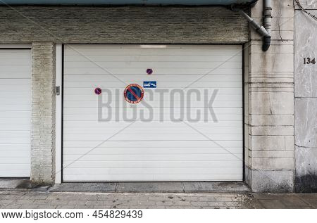 Jette, Brussels Capital Region - Belgium - 09 30 2019 White Residential Garage Port With A No Parkin