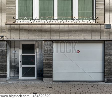 Jette, Brussels Capital Region -belgium - 11 04 2019 Window And Garage Port In A Residential Area