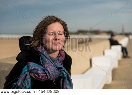 Ostend, West Flanders, Belgium- 10 26 2019 Attractive White Woman With Glasses And Eyes Closed Relax