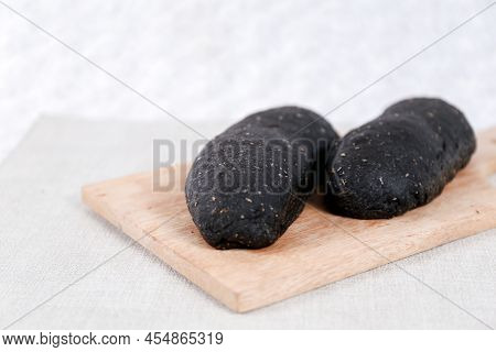 Black Long John Buns Bread With Copy Space For Text