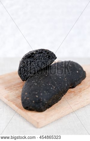 Black Long John Buns Bread With Copy Space For Text