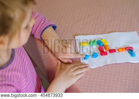 Little Creative Toddler Girl Making Colorful Giraffe With Playmais. Active Happy Child Having Fun Wi
