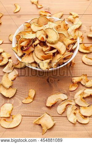 Homemade Dried Organic Apple Sliced On Wood Background