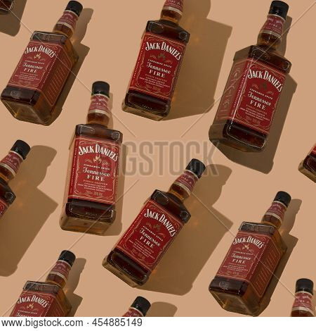 Pattern Whiskey Bottle Jack Daniels Red Label. Bottles Background. Jennessee Fire Cinnamon Liqueur T