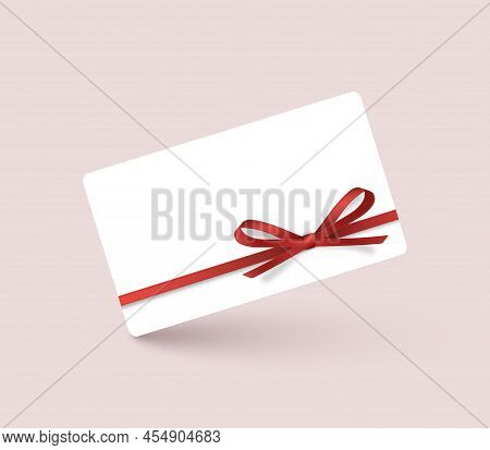 White Gift Voucher With Red Ribbons And Bows. Template For A Festive Gift Coupon, Invitation And Cer