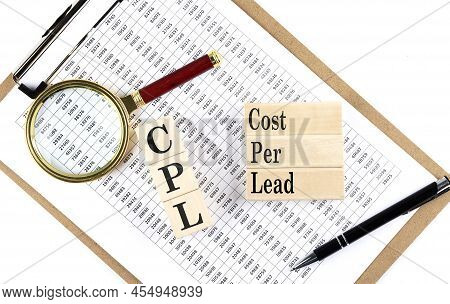 Cpl - Cost Per Lead Text On A Wooden Block On Chart Background