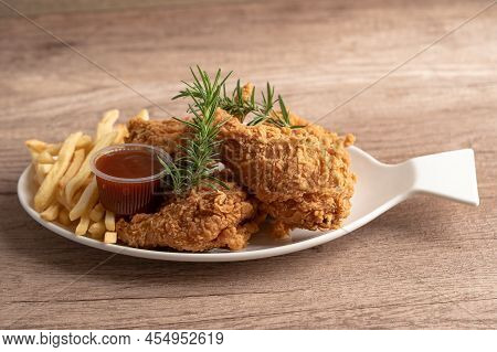 Fried Chicken And Potato Chip With Rosemary Leaf, Junk Food High Calorie Served On White Plate