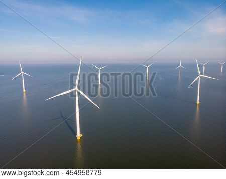 Windmill Farm In The Ocean Westermeerwind Park, Windmills Isolated At Sea On A Beautiful Bright Day 