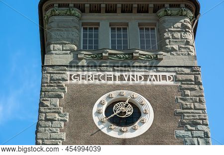 German Inscription Gerecht Und Mild - English Translation Just And Mild - On The Historical Tower Of