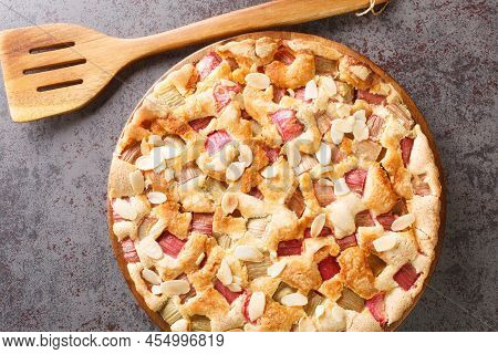 Traditional Fresh Rhubarb Pie With Almonds Close-up In A Dish On The Table. Horizontal Top View From