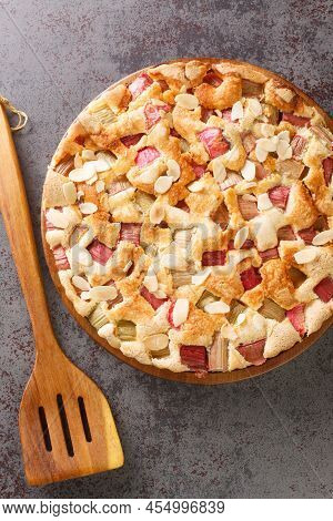 Swedish Rhubarb Cake Rabarberkaka With Almond Flakes Closeup In The Plate On The Table. Vertical Top