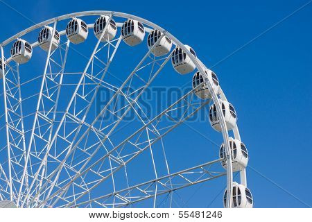 Ferris Wheel on a blue sky background