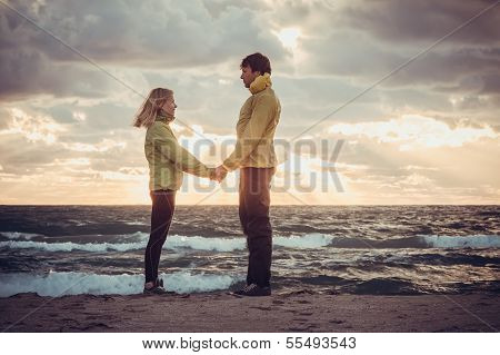 Couple Man And Woman In Love Standing On Beach Seaside Holding Hand In Hand With Beautiful Sunset Sk