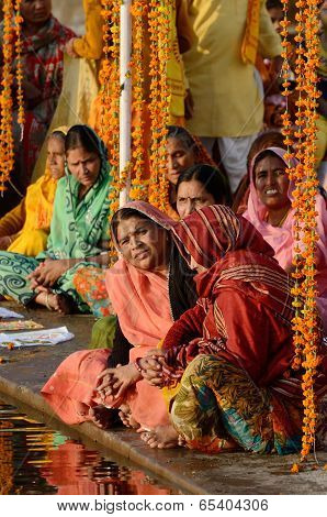 senior women perform puja - ritual ceremony at holy Pushkar town,Rajasthan