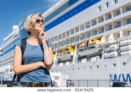 Woman in front of cruise liner