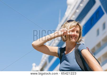 Woman with map, in front of cruise liner