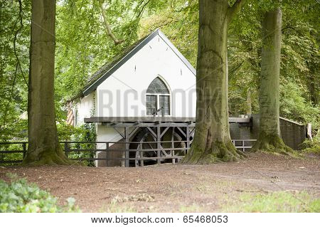 Watermill With Bladewheel In Forest