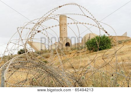Monument to the Negev Brigade in Beer Sheva Israel seen through the barbed wire