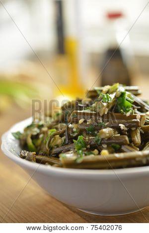 Sauteed bracken fern with sesame oil and seeds