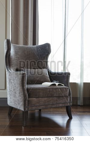 Armchair with Book and Eyeglass room interior decoration