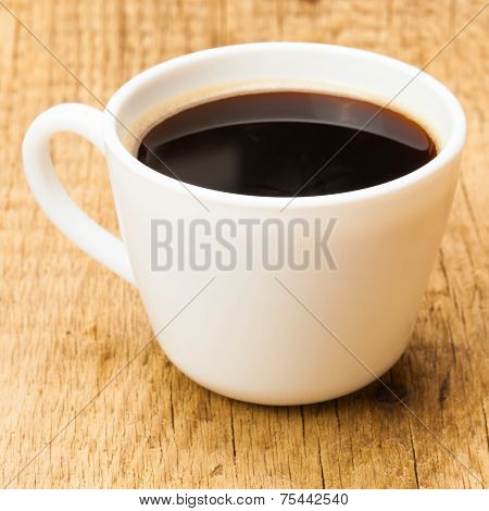 Black Coffee In White Ceramic Cup On Wooden Table - Studio Shoot