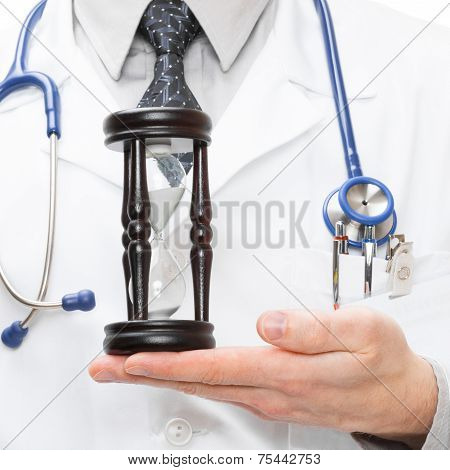 Doctor Holdling In His Hand A Hourglass