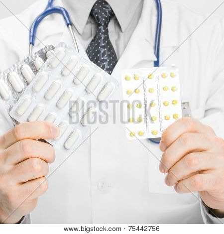 Doctor Holdling Pills In His Hands - Heath Care Concept