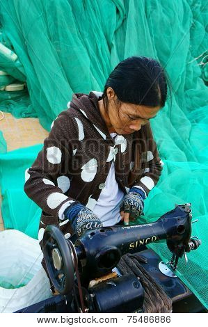 Vietnamese Woman Sew Fishing Net
