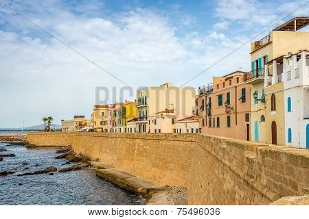 City Wall With Colored Houses In Alghero