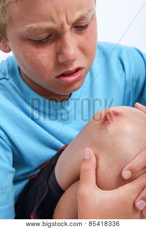 Boy with scraped knee