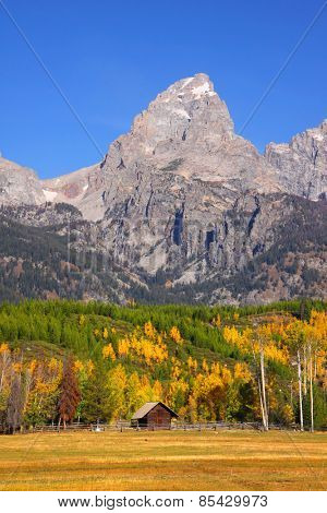 Old barn in front of Grand Tetons range