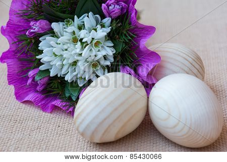 Snowdrop flowers and wooden eggs