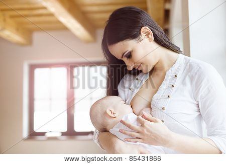 Mother breastfeeding her baby