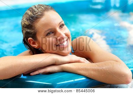 Young woman relaxing in hot tub. Summer vacation.