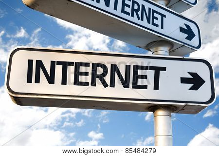 Internet direction sign on sky background