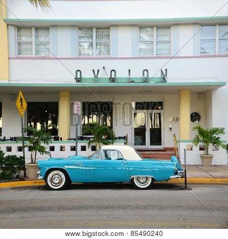 MIAMI - DEC 25, 2012: 1957 Ford Thunderbird in front of Art Deco style Avalon Hotel in Miami Beach in Miami, Florida, USA