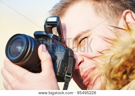 close-up of amateur photographer preparing to photograph