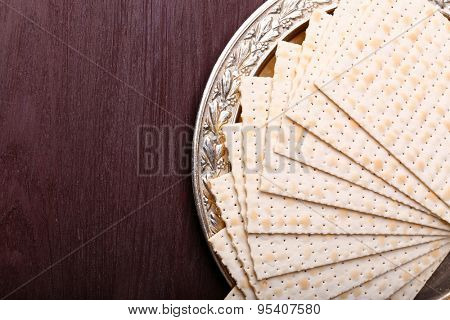 Matzo for Passover on metal tray on table close up