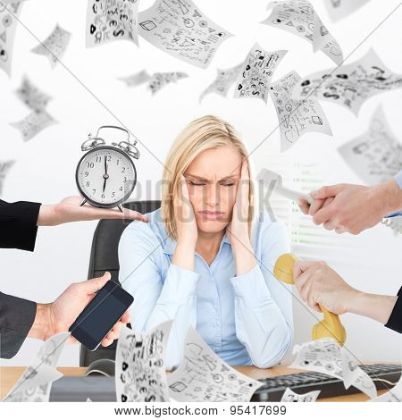 hand holding alarm clock against frustrated looking woman with eyes closed