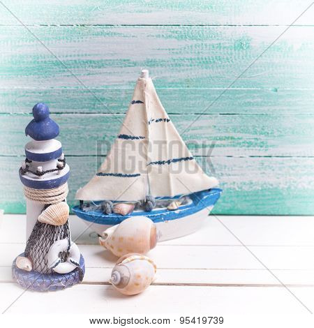 Decorative Lighthouse,  Sailing Boats And Marine Items On Wooden Background.