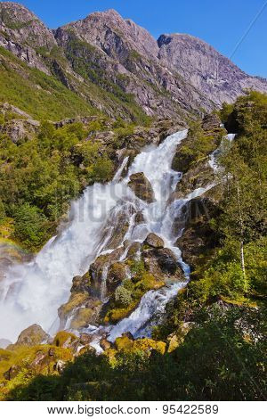 Waterfall near Briksdal glacier - Norway - nature and travel background